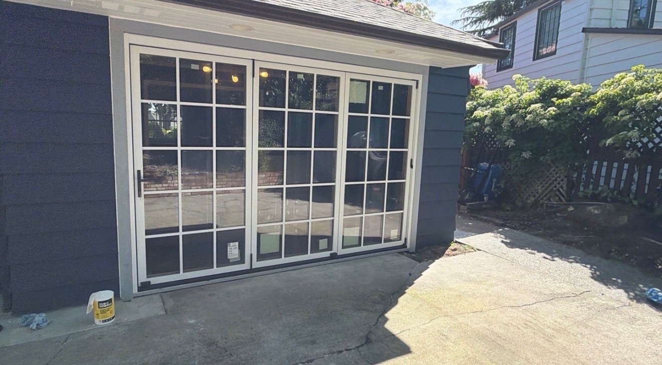 After: modern multi-panel sliding glass door installed by JVL Construction